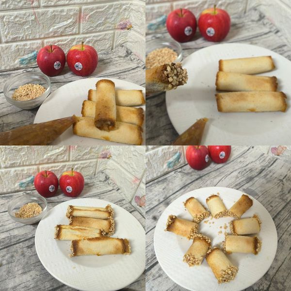 6
將烤好的圓筒吐司捲邊緣先擠上剛剛煮好的蘋果肉桂餡，再沾裹上以烤熟的的杏仁粒，接著從另一端擠入擠滿蘋果肉桂餡，擠好後也沾裹上熟杏仁粒，再將蘋果吐司捲對切成兩小段，切口處也再沾上熟杏仁粒。