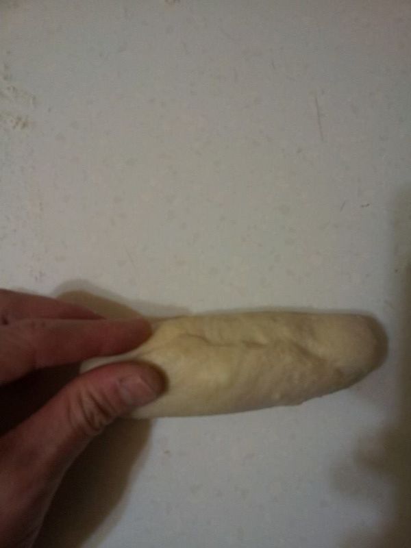 收口捏緊之後朝下