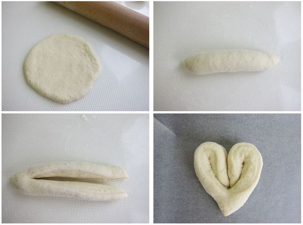取一份小麵團，擀開後由一邊捲起成長形。再從麵團中線切開(一端保留1.5cm不切斷)，分開後將兩端往內反摺成心型。排列至舖有烘焙紙的烤盤上進行最後發酵至兩倍大。
