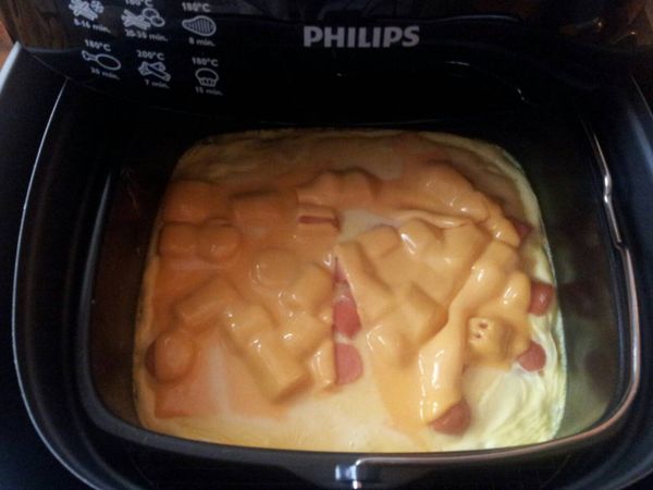 十分鐘後在表麵上鋪上起司，在烘烤5分鐘