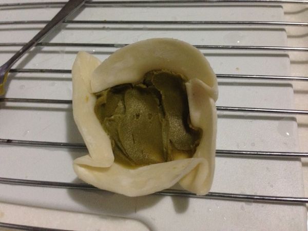 在將四個角折起來
（變成聚寶盆）