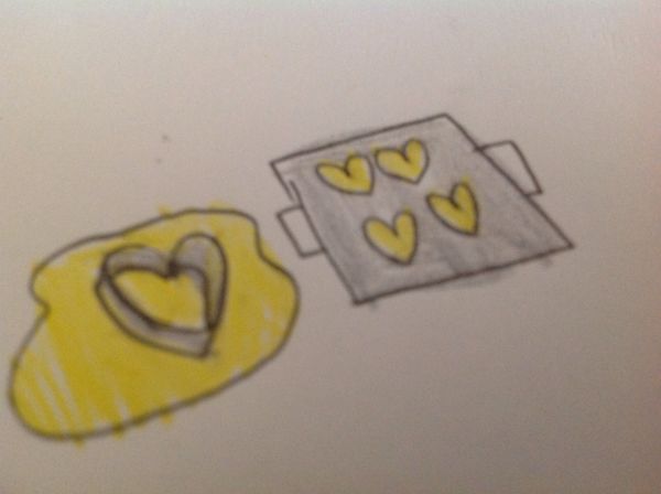 用愛心模子將麵團壓成心形。