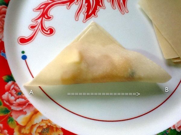 5.3再將圖片中A點拉到B點上貼合。
   （不易貼合時，可於黏貼處表面抹上少許的水）