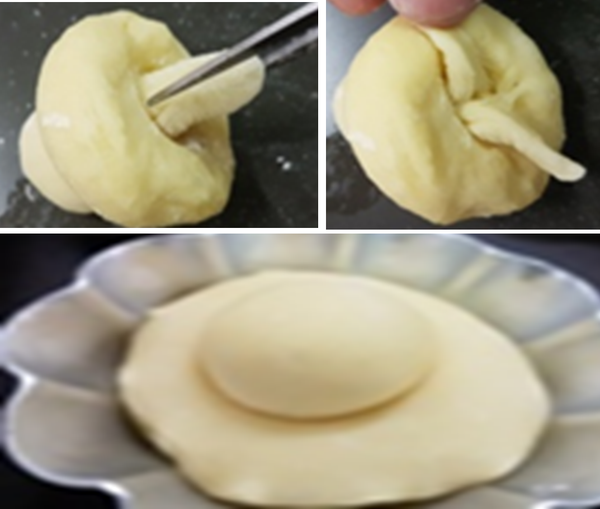 再將穿過的麵糰用剪刀剪成二條，向二邊撥開再放到烤模中。
(當麵糰發至兩倍大，以手指按壓不回彈則完成最後發酵，即可進行烤焙)